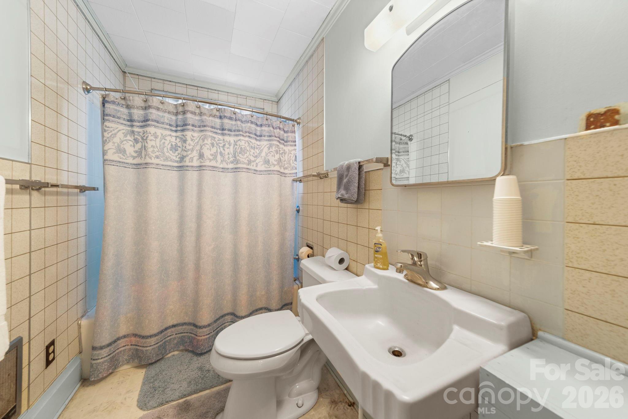 2350 Grubb Ferry Road Salisbury, NC 28144 - Photo 28 of 31 a bathroom with a sink toilet and shower