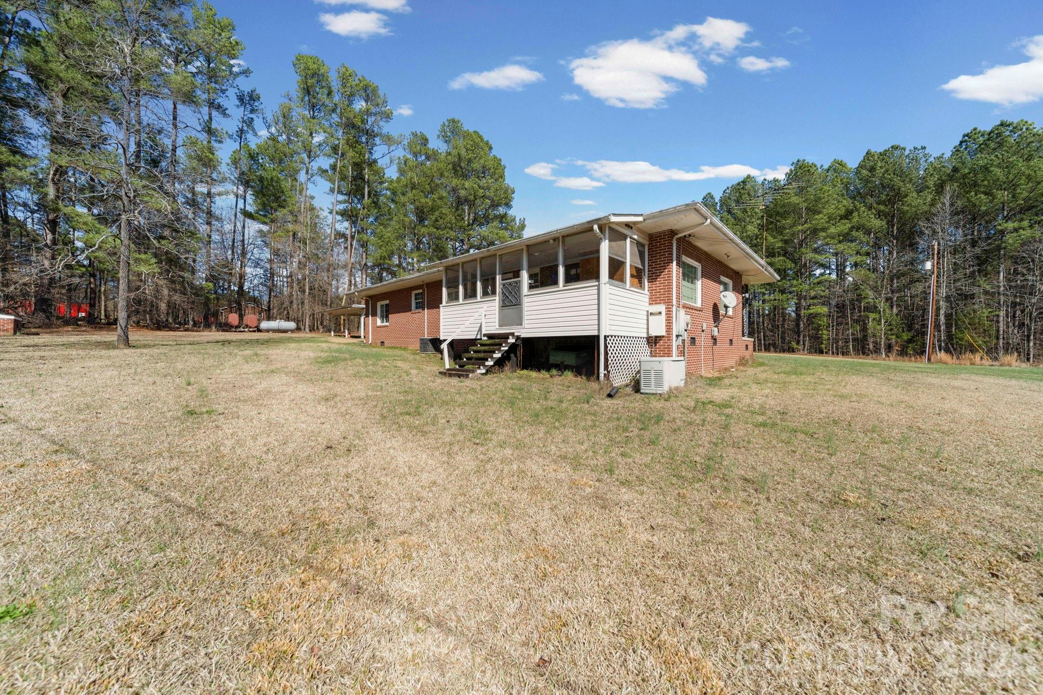 2350 Grubb Ferry Road Salisbury, NC 28144 - Photo 7 of 31 a front view of a house with a yard