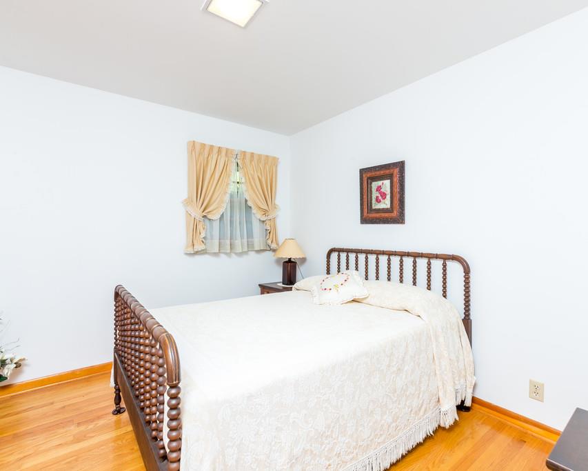 2960 Lewis Branch Road Tennessee Ridge, TN 37178 - Photo 13 of 24 a bedroom with a bed and a lamp on table