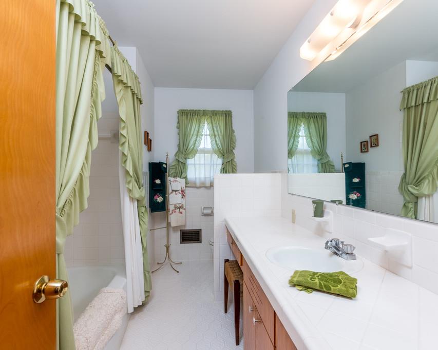 2960 Lewis Branch Road Tennessee Ridge, TN 37178 - Photo 14 of 24 a spacious bathroom with a sink double vanity mirror and tub