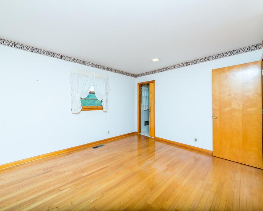 2960 Lewis Branch Road Tennessee Ridge, TN 37178 - Photo 17 of 24 a view of an empty room with wooden floor