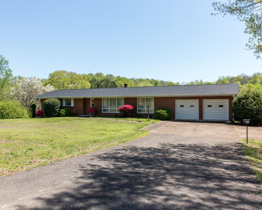 2960 Lewis Branch Road Tennessee Ridge, TN 37178 - Photo 24 of 24 a front view of a house with a yard and garage