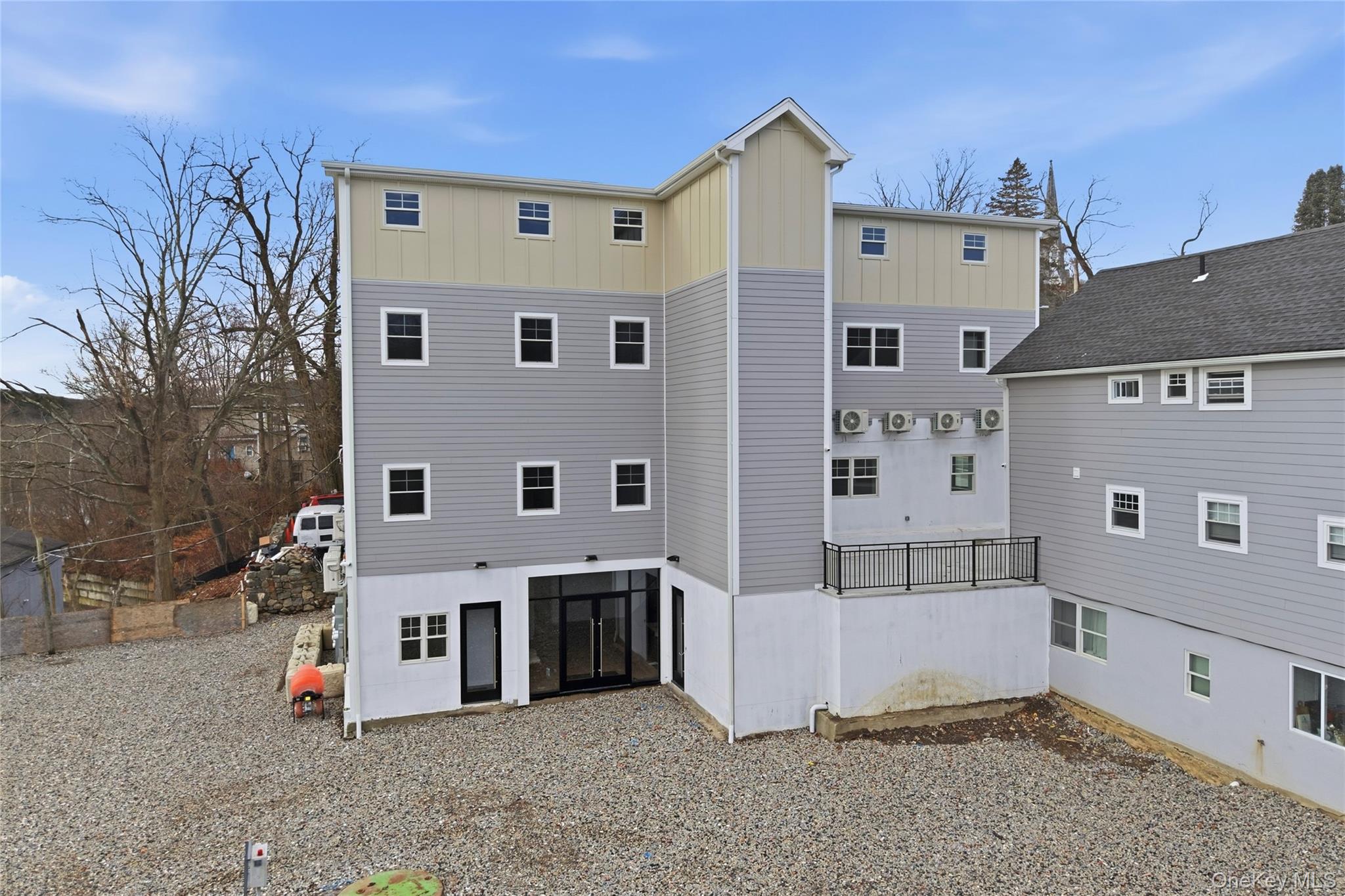 99 Main Street, Unit 2B Brewster, NY 10509 - Photo 11 of 11 a view of a house with a big yard