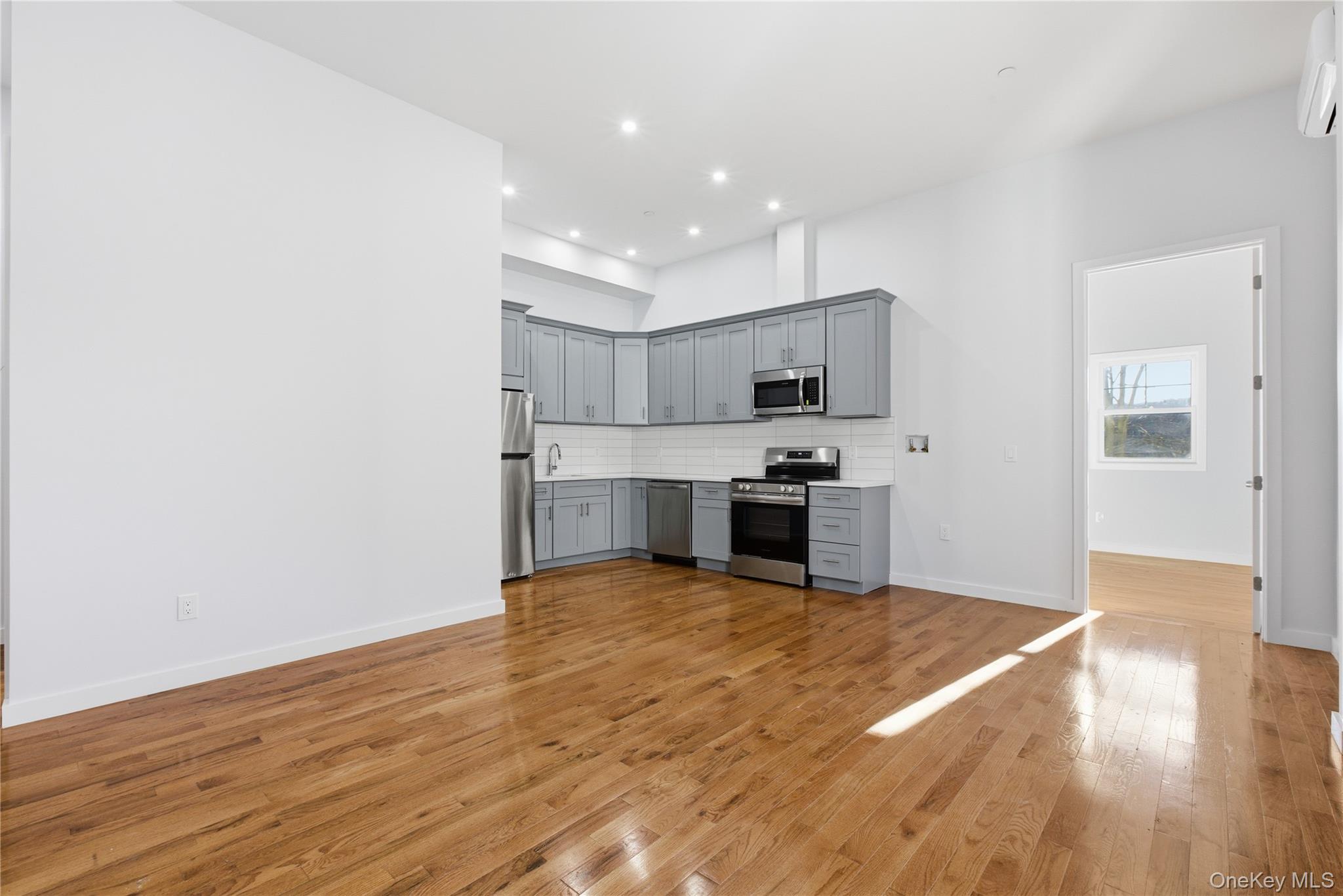 99 Main Street, Unit 2B Brewster, NY 10509 - Photo 2 of 11 a view of kitchen with wooden floor