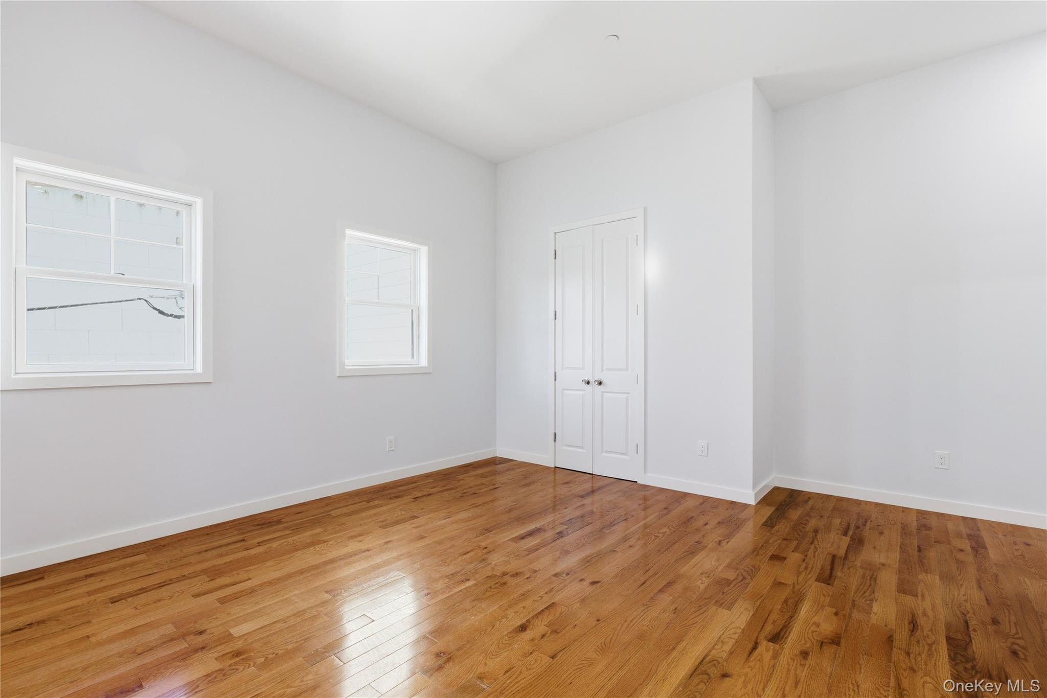 99 Main Street, Unit 2B Brewster, NY 10509 - Photo 5 of 11 a view of empty room with wooden floor