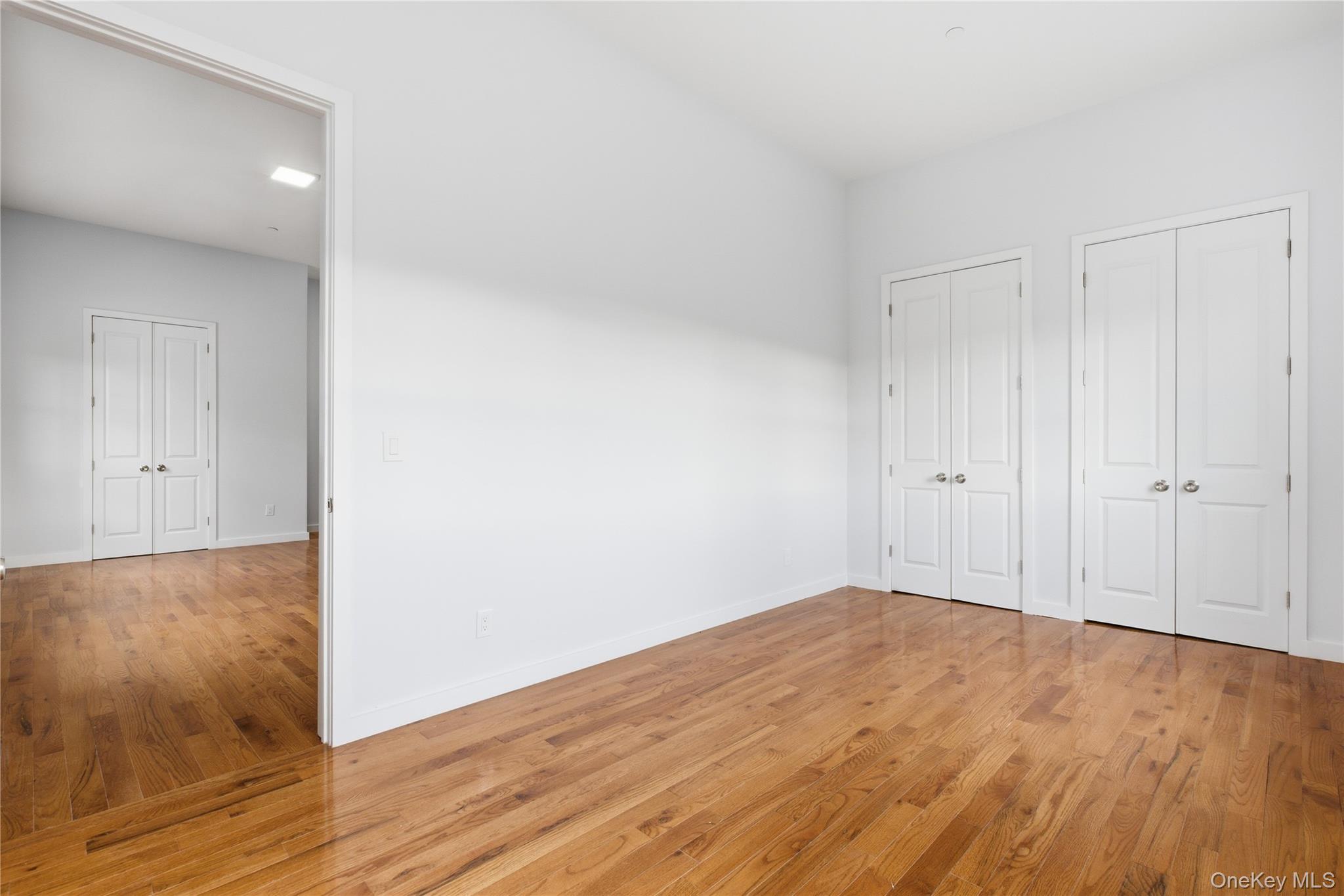 99 Main Street, Unit 2B Brewster, NY 10509 - Photo 7 of 11 a view of a room with wooden floor