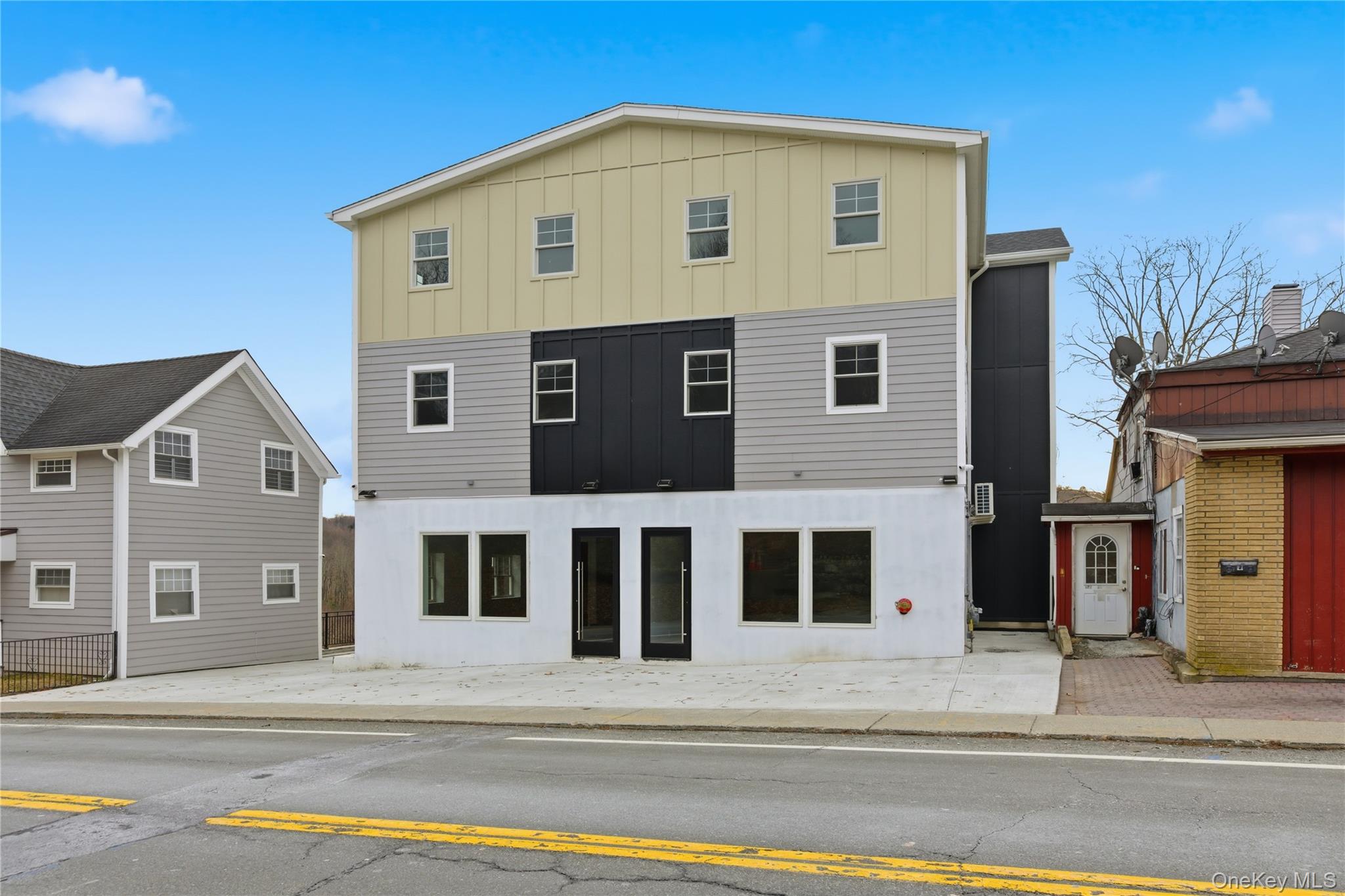 99 Main Street, Unit 2B Brewster, NY 10509 - Photo 9 of 11 a view of a house with a balcony