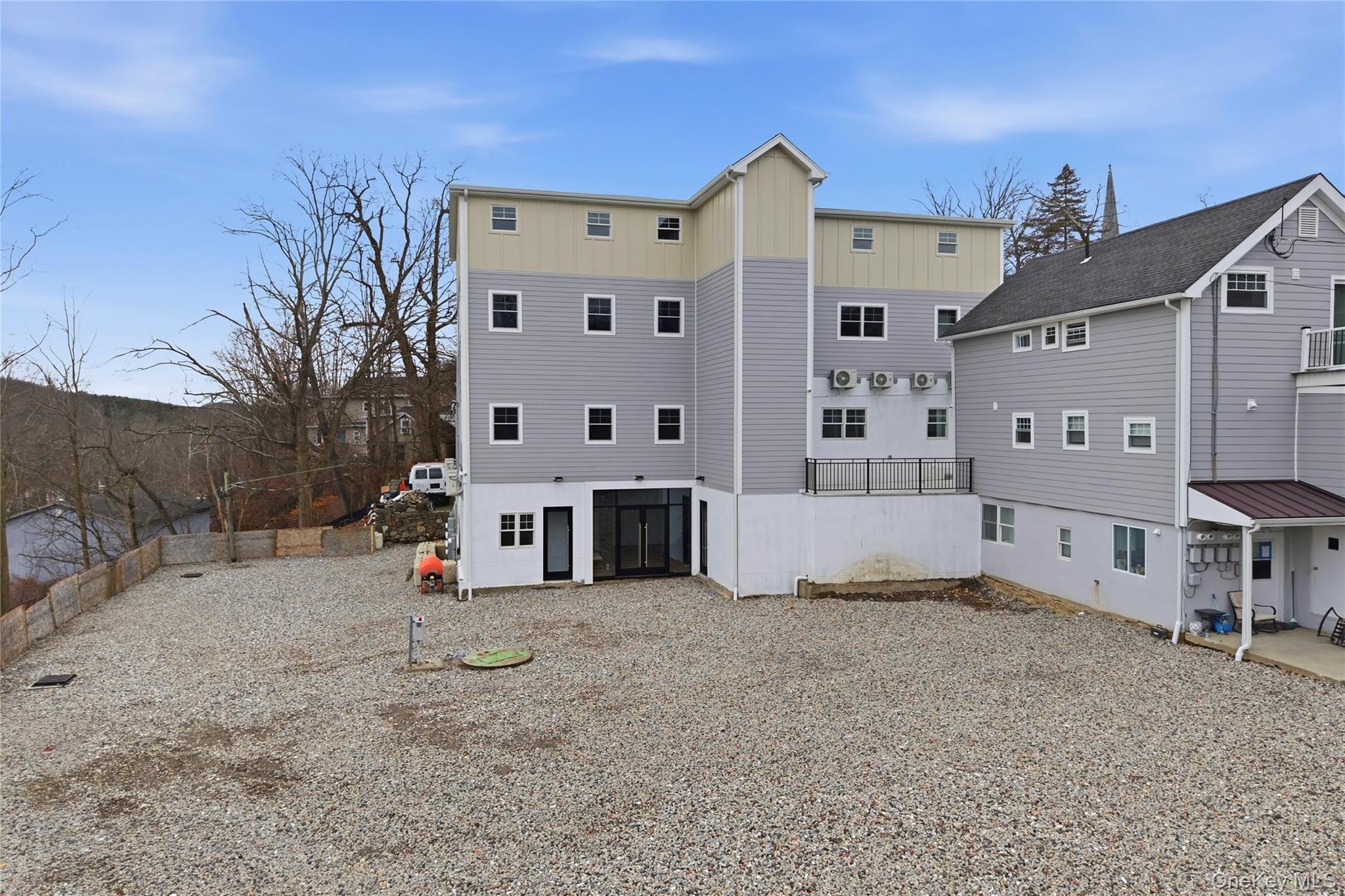 99 Main Street, Unit 2B Brewster, NY 10509 - Photo 10 of 11 a view of a house with backyard and trees