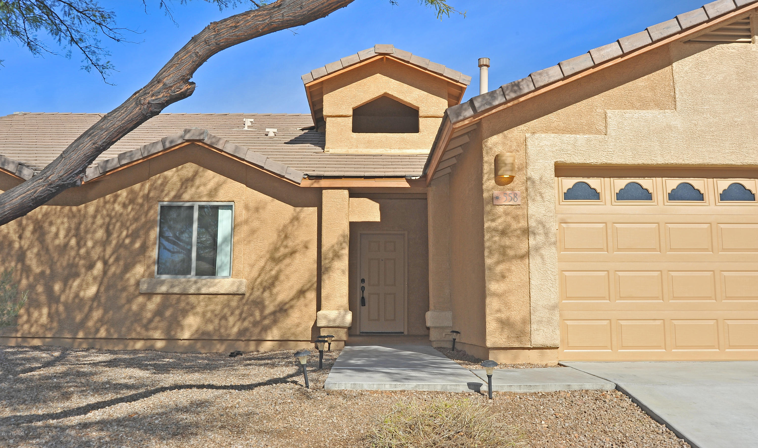 558 West Chatfield Street Vail, AZ 85641 - Photo 30 of 31 a view of a house with a door and wooden walls