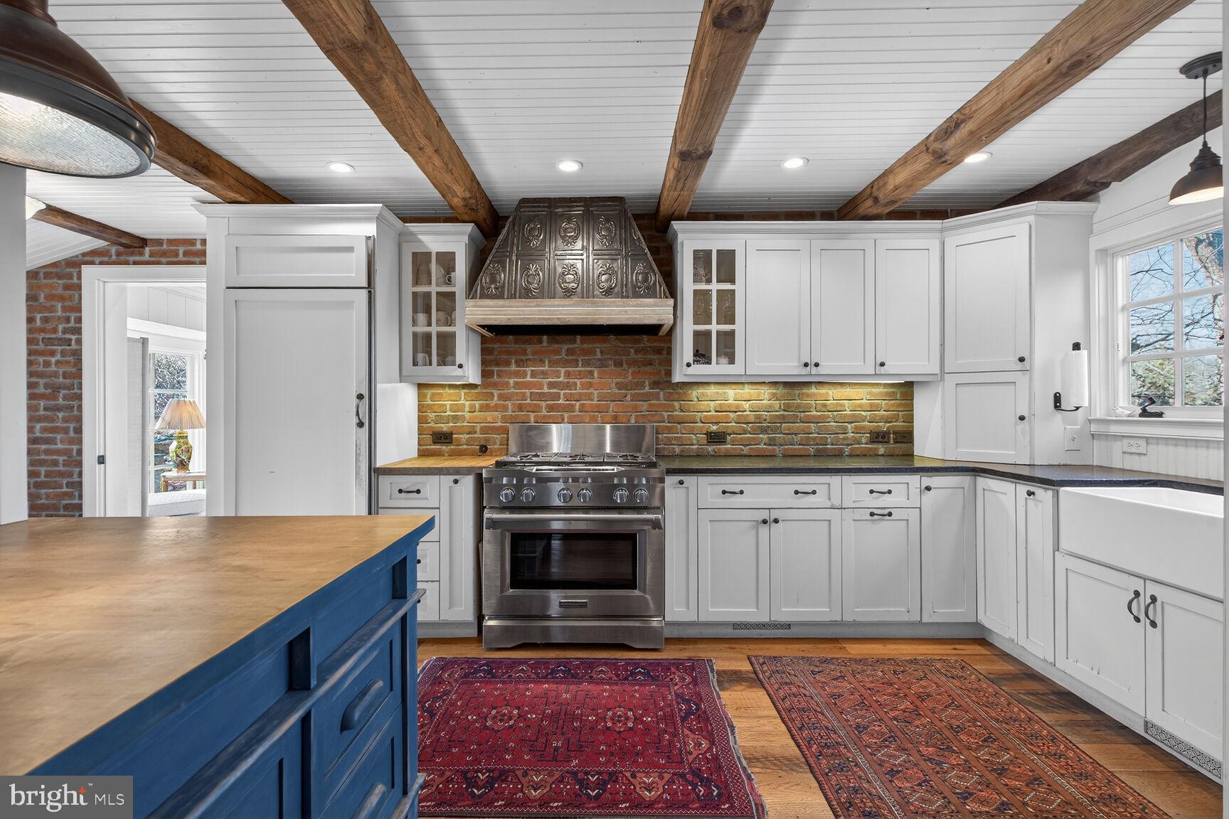 17651 Raven Rocks Road Bluemont, VA 20135 - Photo 14 of 87 a kitchen with stainless steel appliances granite countertop a sink stove and cabinets