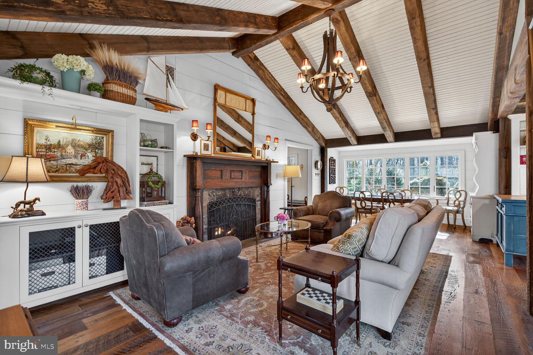 17651 Raven Rocks Road Bluemont, VA 20135 - Photo 18 of 87 a living room with furniture a fireplace and a floor to ceiling window