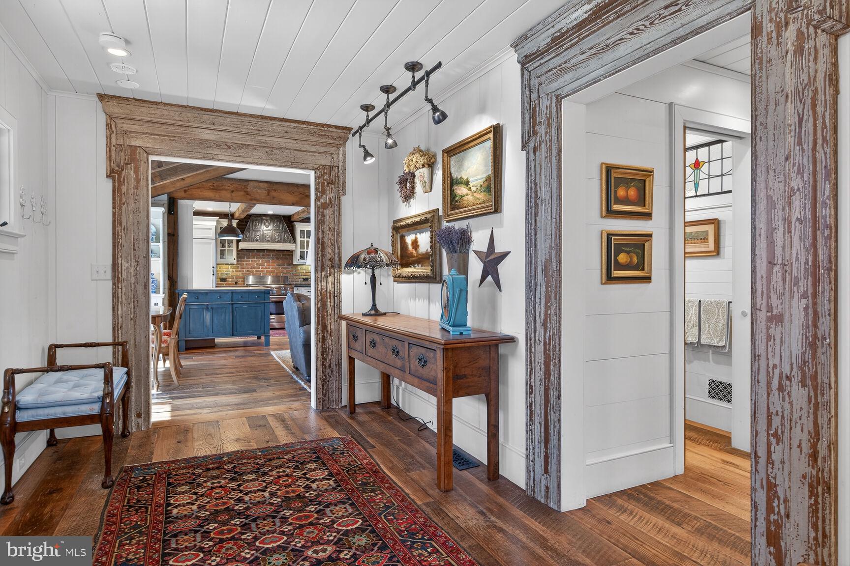 17651 Raven Rocks Road Bluemont, VA 20135 - Photo 26 of 87 a hallway with wooden floor and furniture