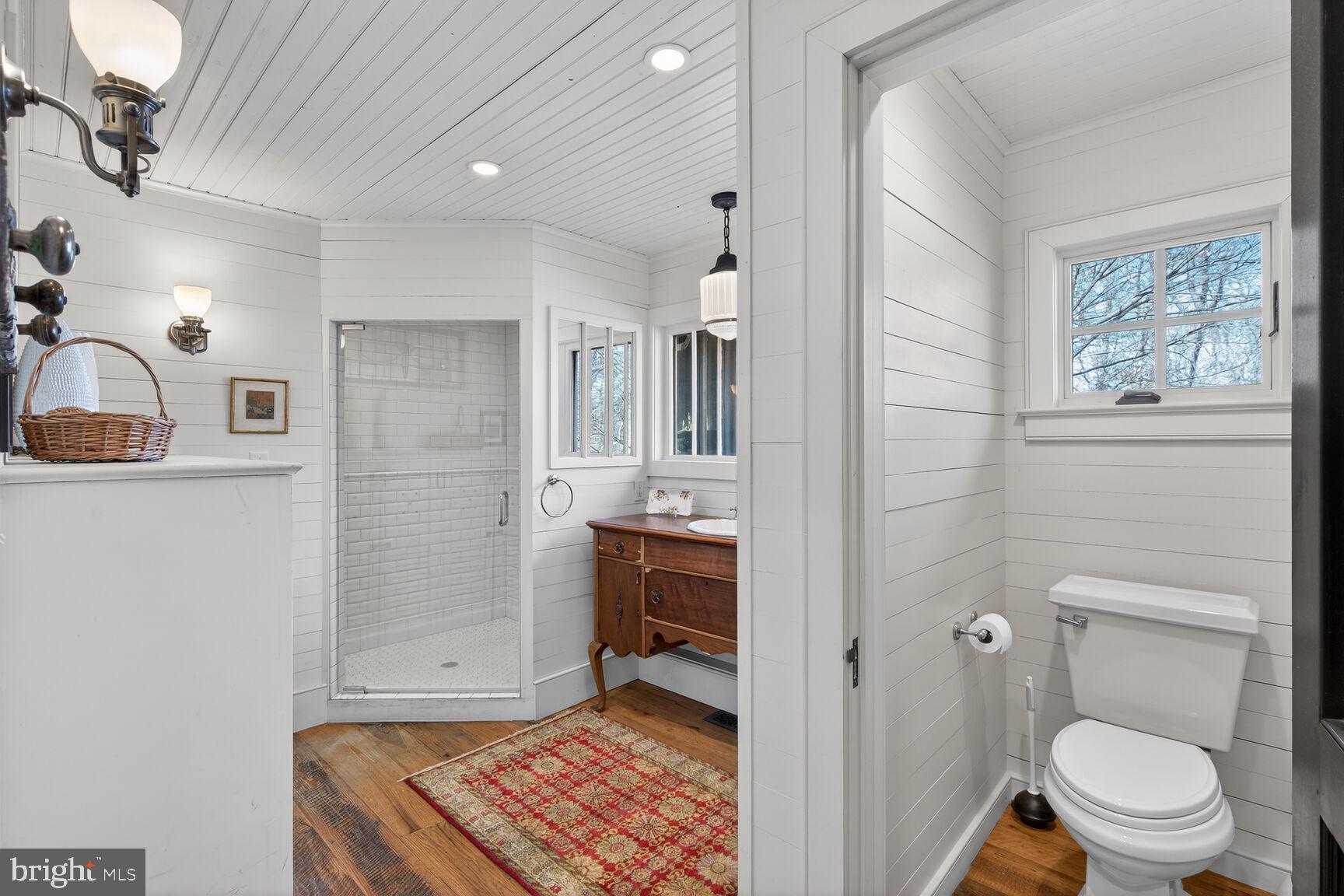 17651 Raven Rocks Road Bluemont, VA 20135 - Photo 38 of 87 a bathroom with a toilet a sink and shower