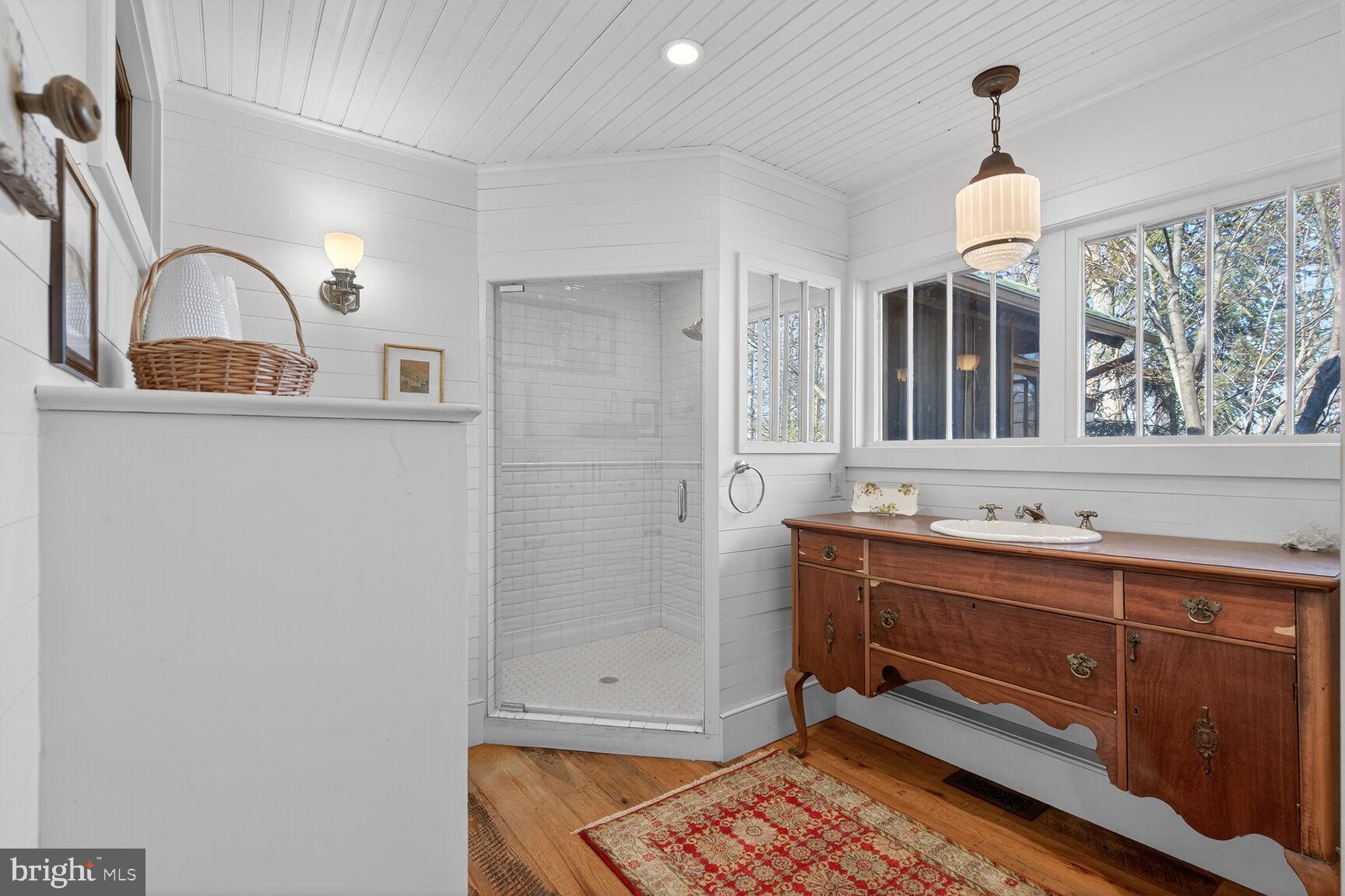 17651 Raven Rocks Road Bluemont, VA 20135 - Photo 39 of 87 a bathroom with a sink and a mirror