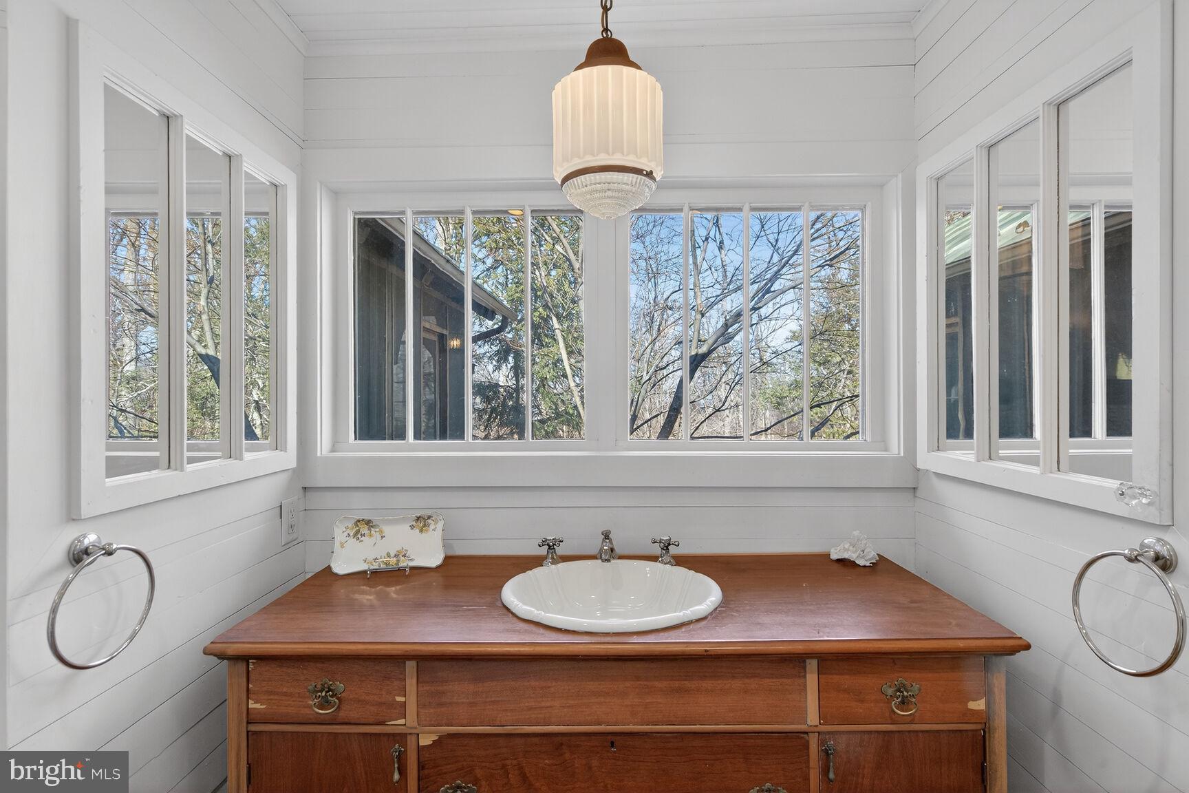 17651 Raven Rocks Road Bluemont, VA 20135 - Photo 40 of 87 a bathroom with a sink and a window