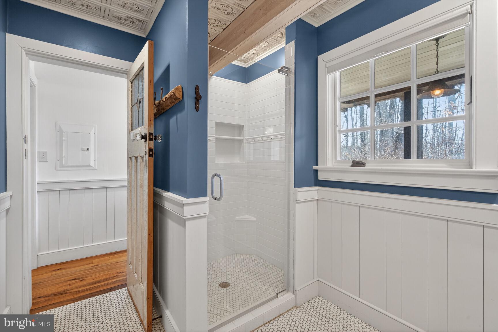17651 Raven Rocks Road Bluemont, VA 20135 - Photo 46 of 87 a bathroom with a glass door shower and a sink