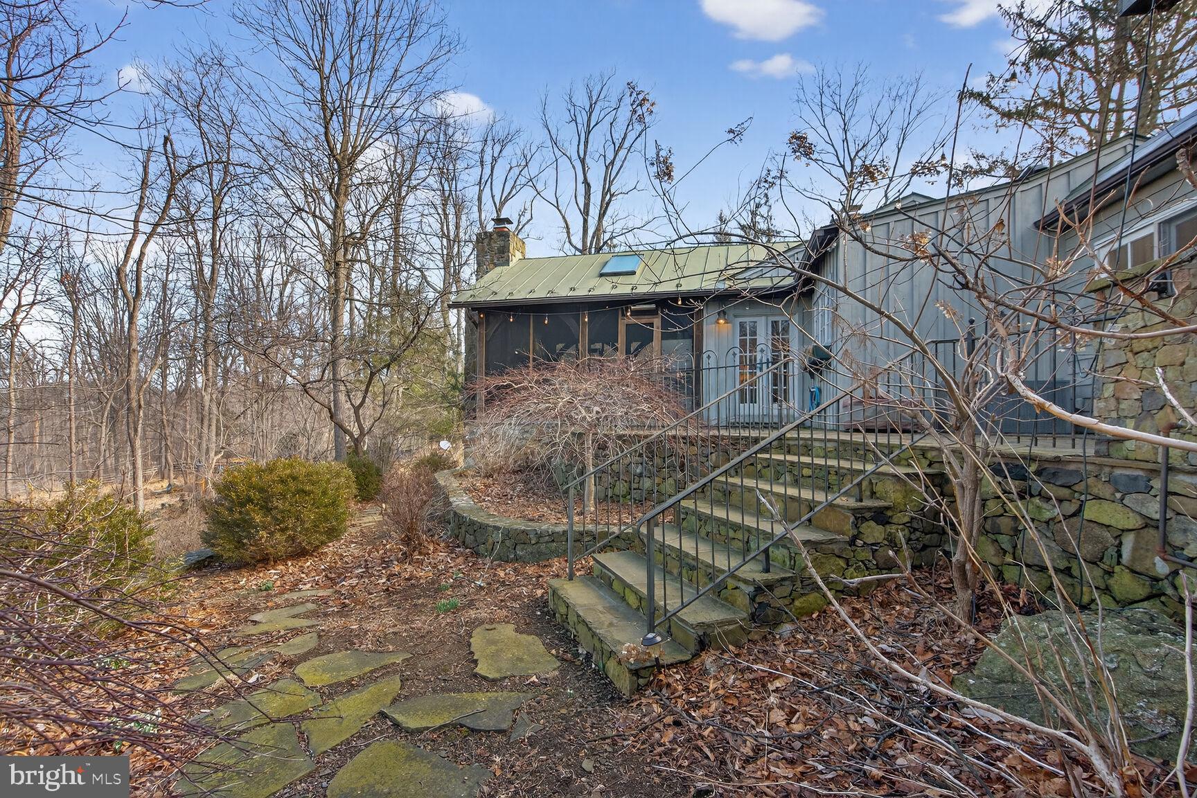 17651 Raven Rocks Road Bluemont, VA 20135 - Photo 54 of 87 a view of a white house with a yard covered with snow