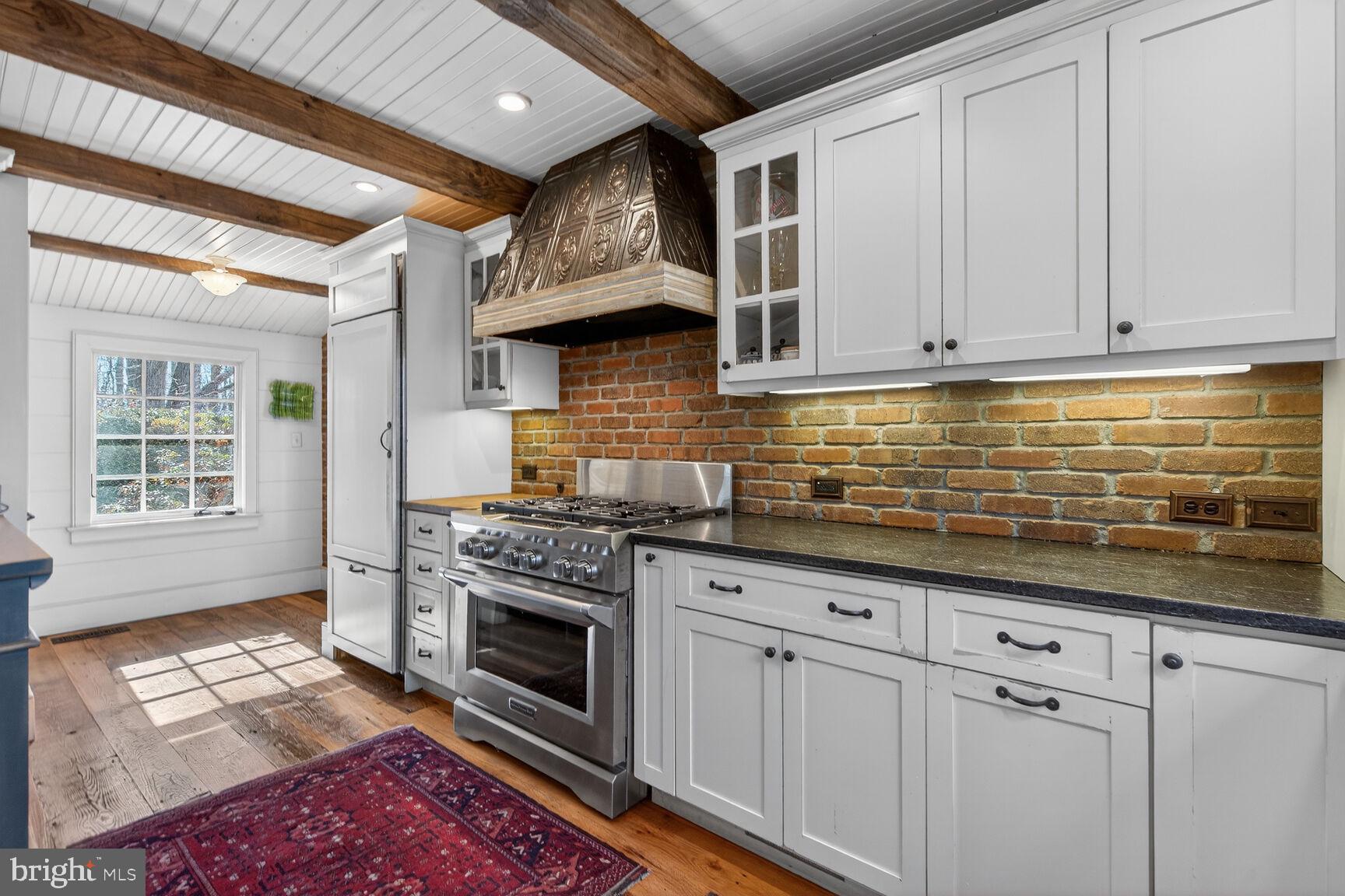 17651 Raven Rocks Road Bluemont, VA 20135 - Photo 6 of 87 a kitchen with stainless steel appliances granite countertop a stove sink and cabinets