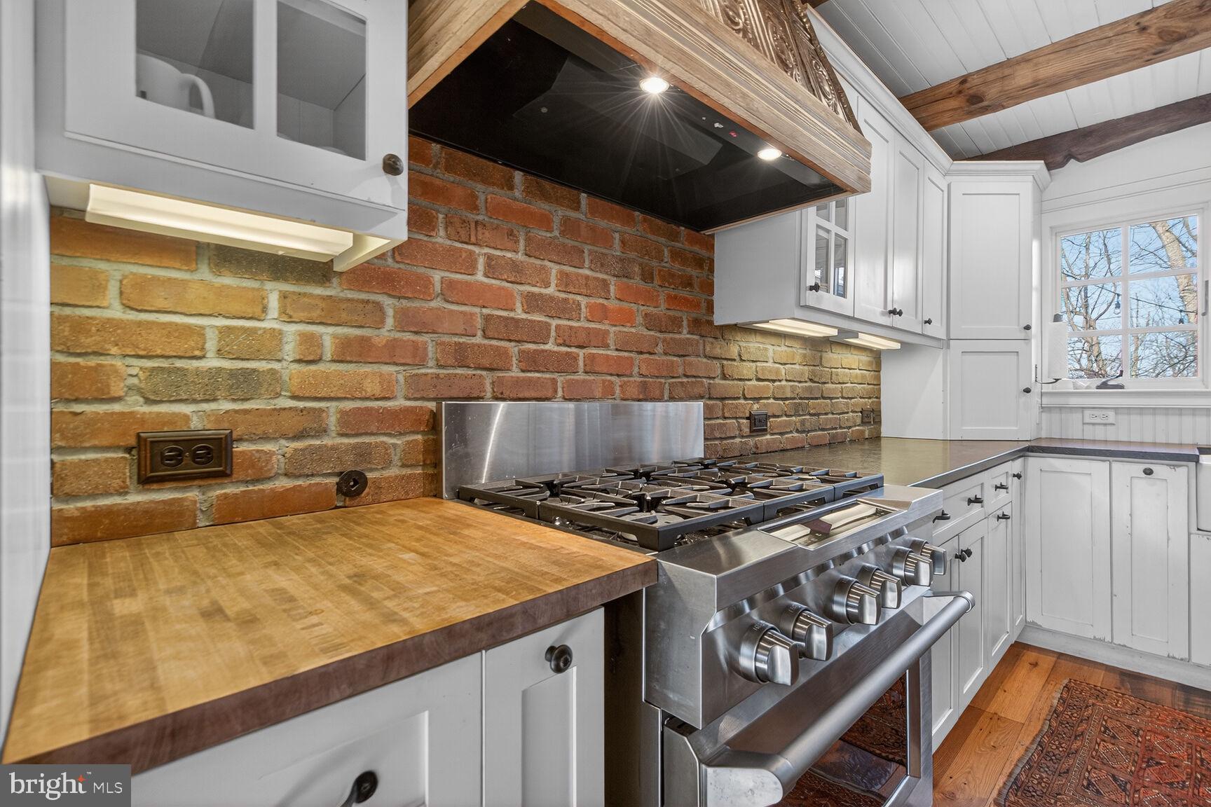 17651 Raven Rocks Road Bluemont, VA 20135 - Photo 9 of 87 a kitchen with a stove a sink and a microwave