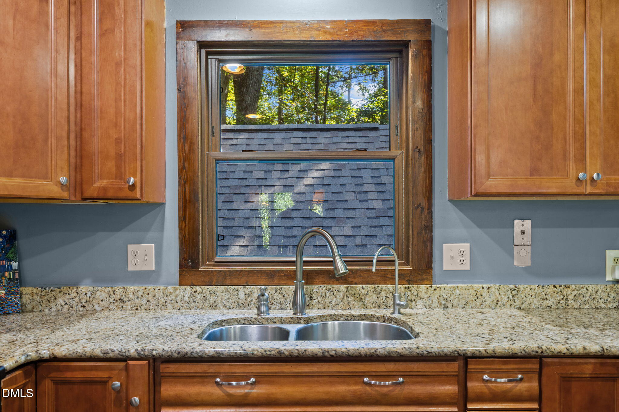 2408 Windsor Trail Raleigh, NC 27615 - Photo 11 of 45 a kitchen with granite countertop a sink and cabinets