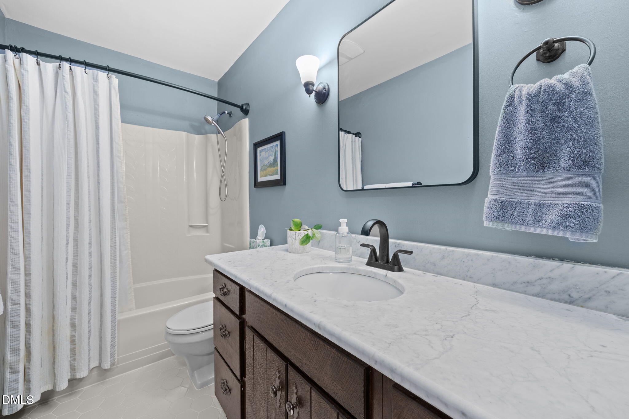 2408 Windsor Trail Raleigh, NC 27615 - Photo 20 of 45 a bathroom with a granite countertop sink a toilet and a mirror