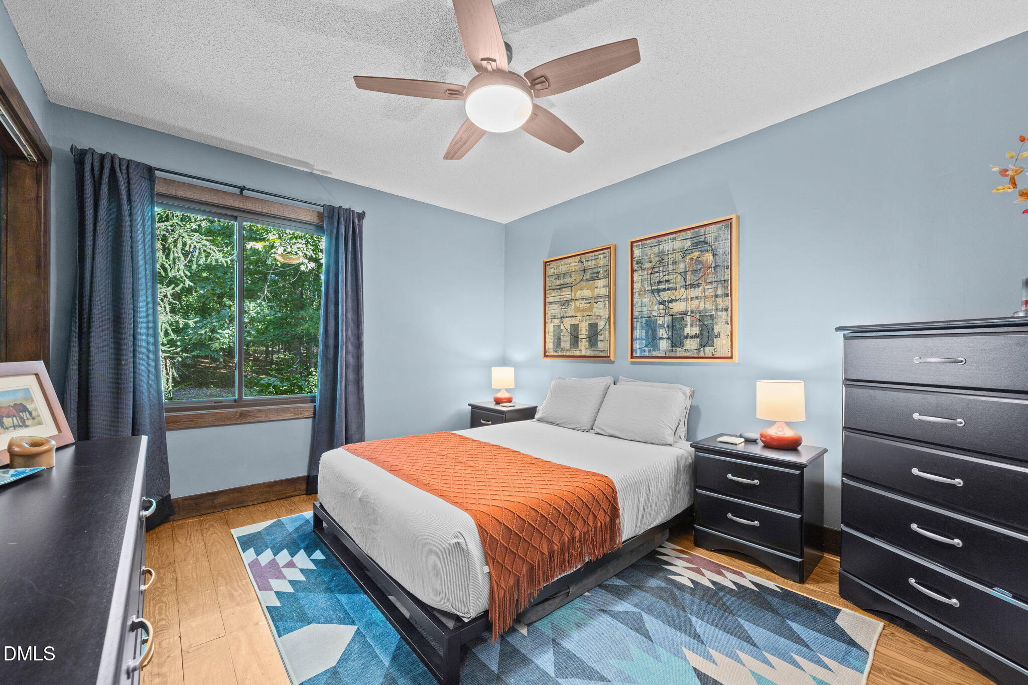 2408 Windsor Trail Raleigh, NC 27615 - Photo 21 of 45 a bedroom with a bed and a chandelier