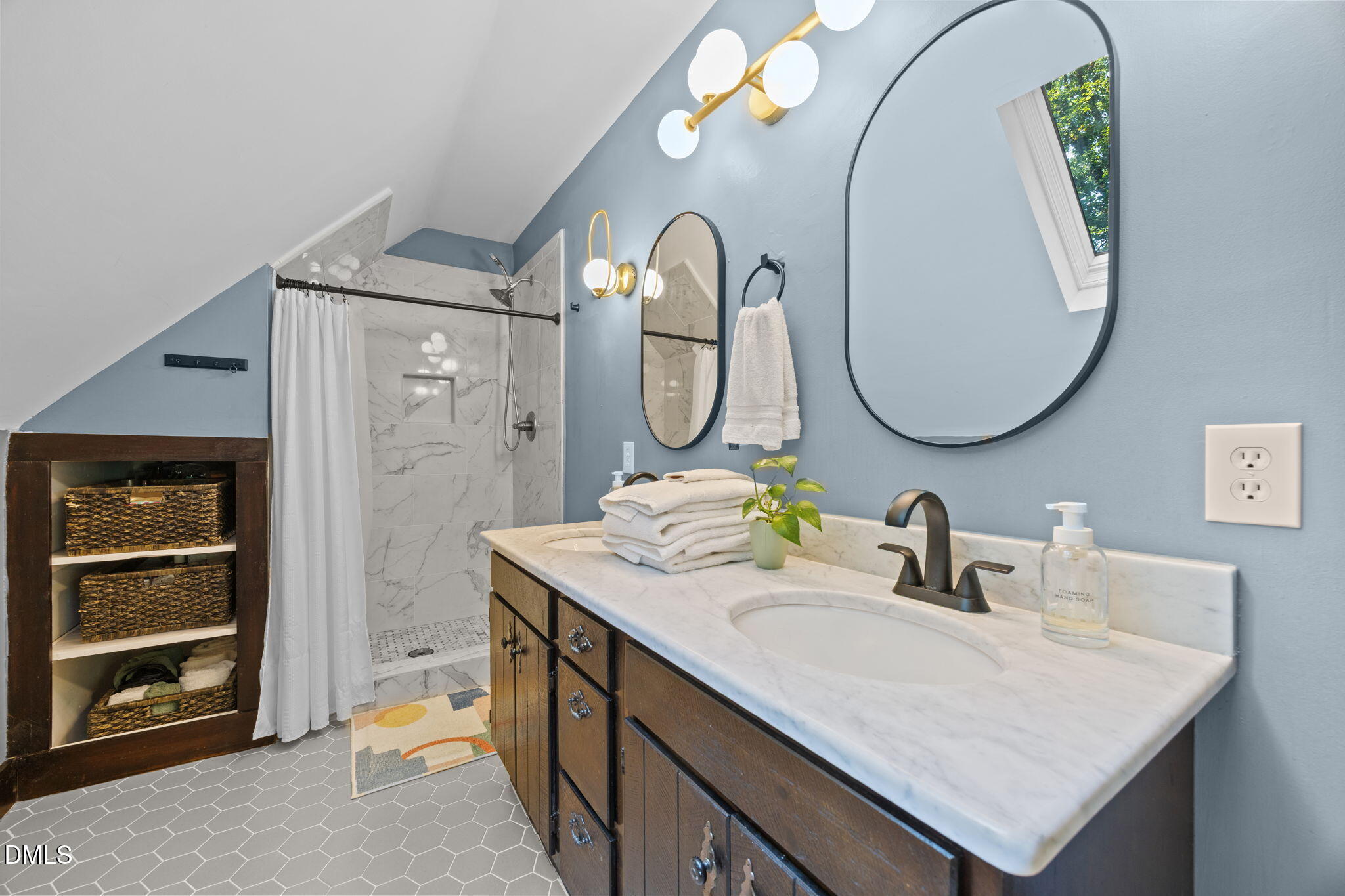 2408 Windsor Trail Raleigh, NC 27615 - Photo 26 of 45 a bathroom with a sink and a mirror