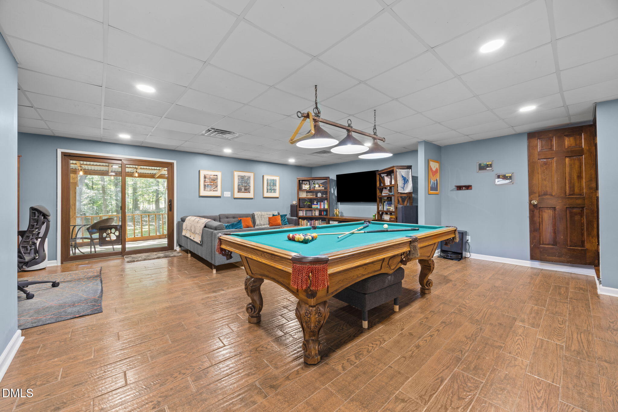 2408 Windsor Trail Raleigh, NC 27615 - Photo 29 of 45 a living room with pool table and a pool table