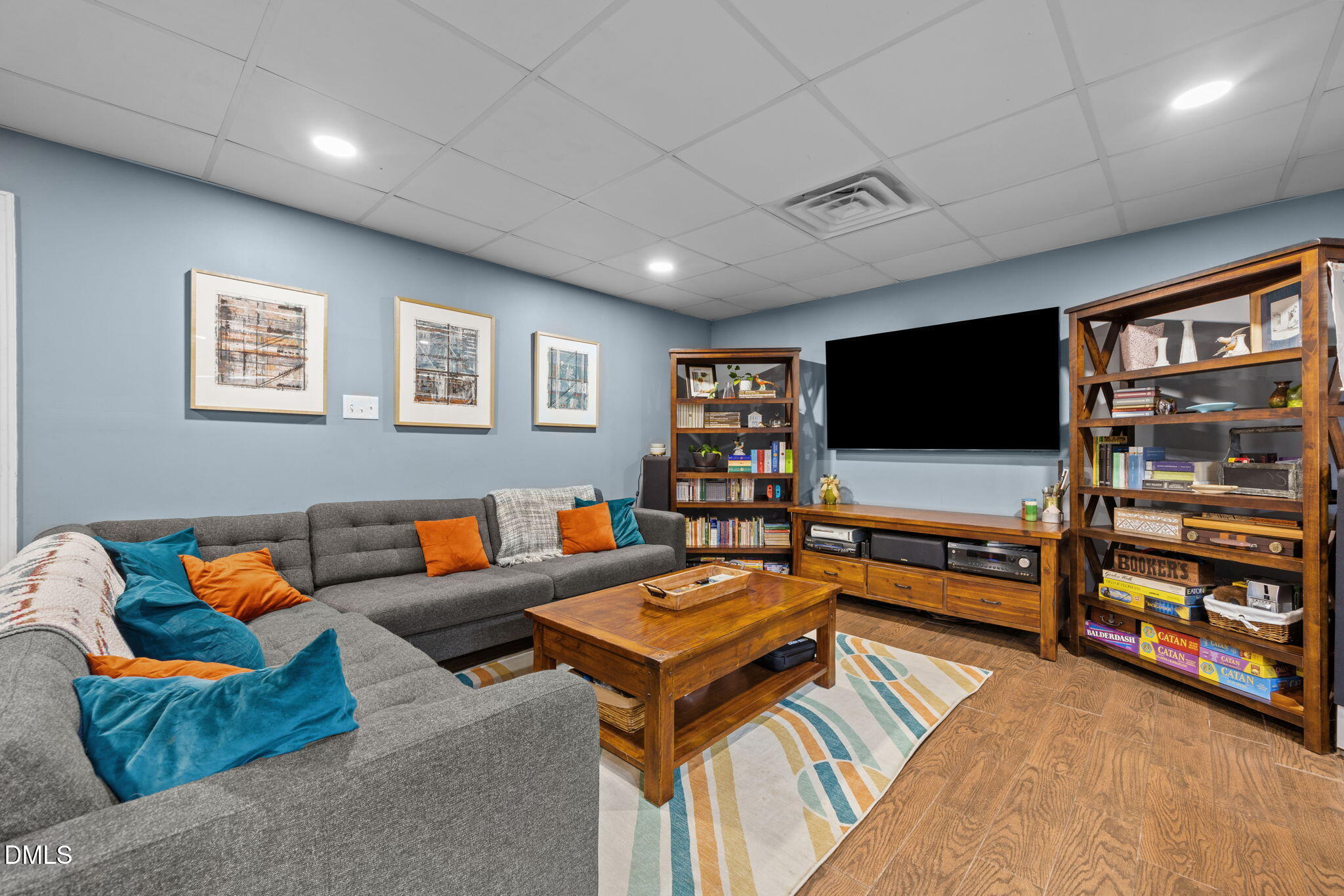 2408 Windsor Trail Raleigh, NC 27615 - Photo 30 of 45 a living room with furniture and a flat screen tv