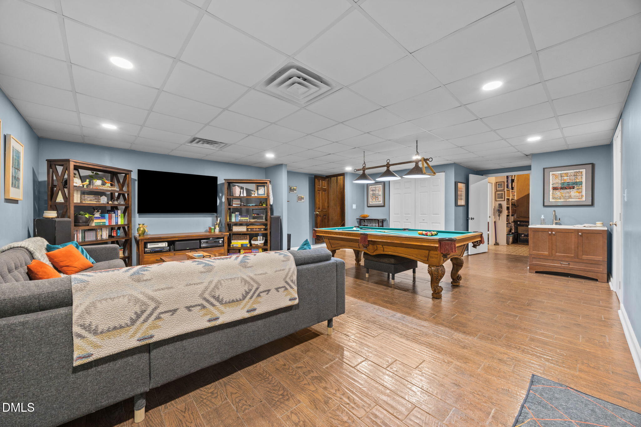 2408 Windsor Trail Raleigh, NC 27615 - Photo 32 of 45 a living room with furniture and a flat screen tv