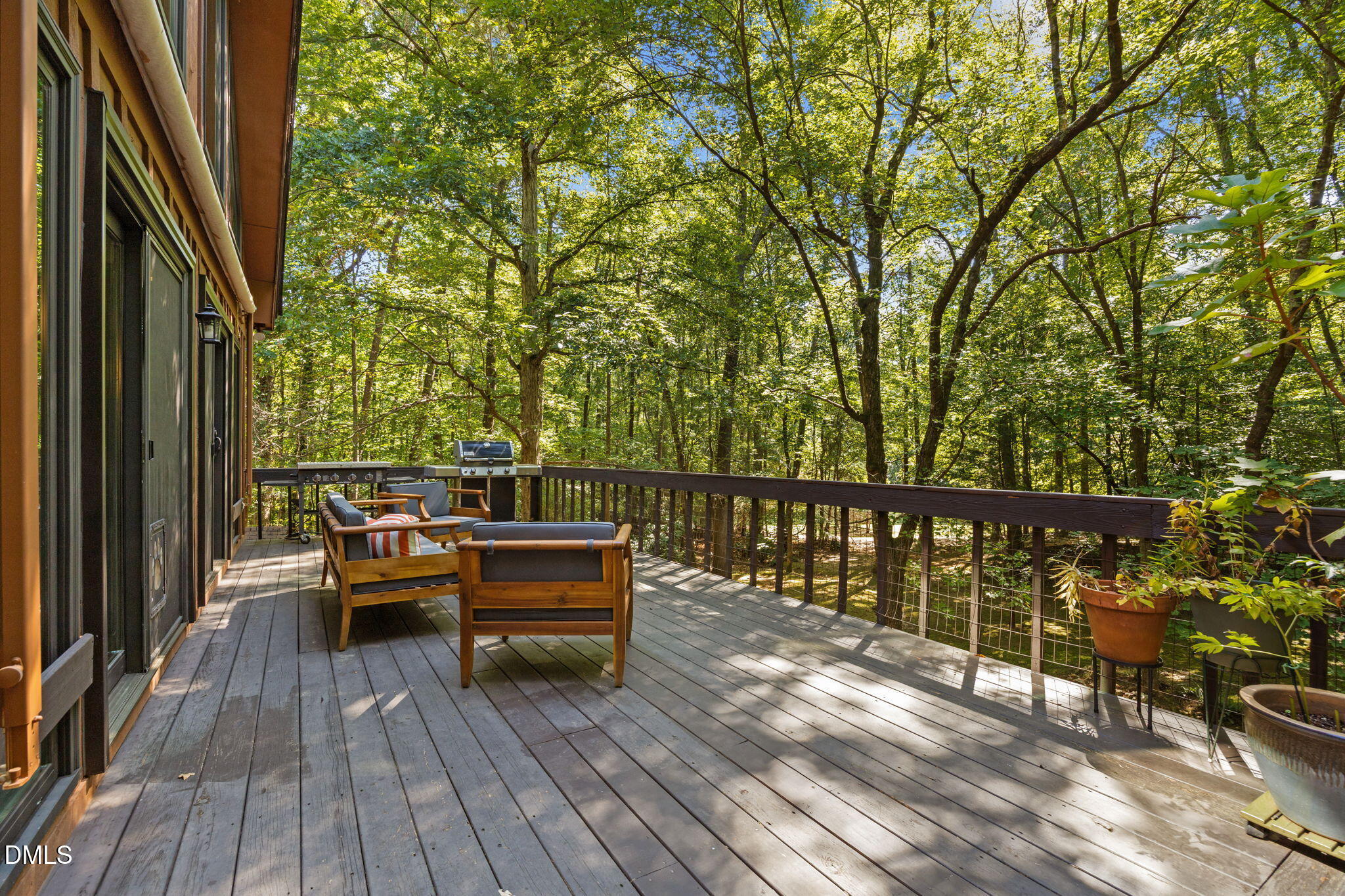 2408 Windsor Trail Raleigh, NC 27615 - Photo 38 of 45 a view of balcony with wooden floor and seating space
