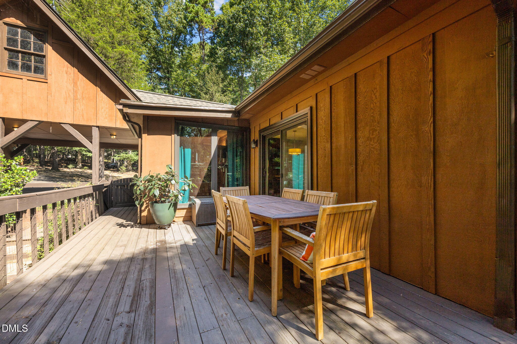 2408 Windsor Trail Raleigh, NC 27615 - Photo 39 of 45 a view of a patio with table and chairs with wooden floor and fence