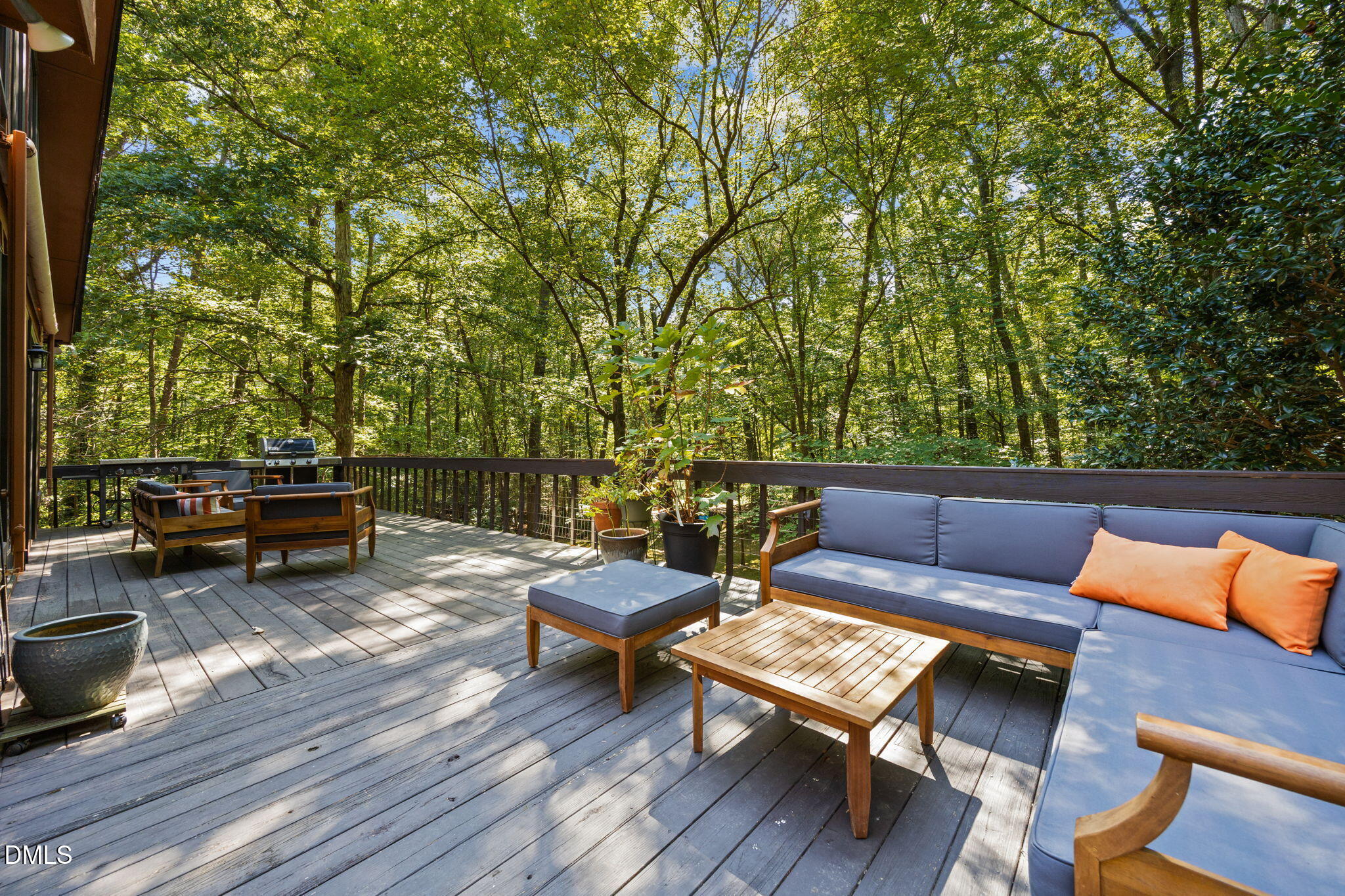 2408 Windsor Trail Raleigh, NC 27615 - Photo 40 of 45 a roof deck with a couple of couches and potted plants with wooden floor