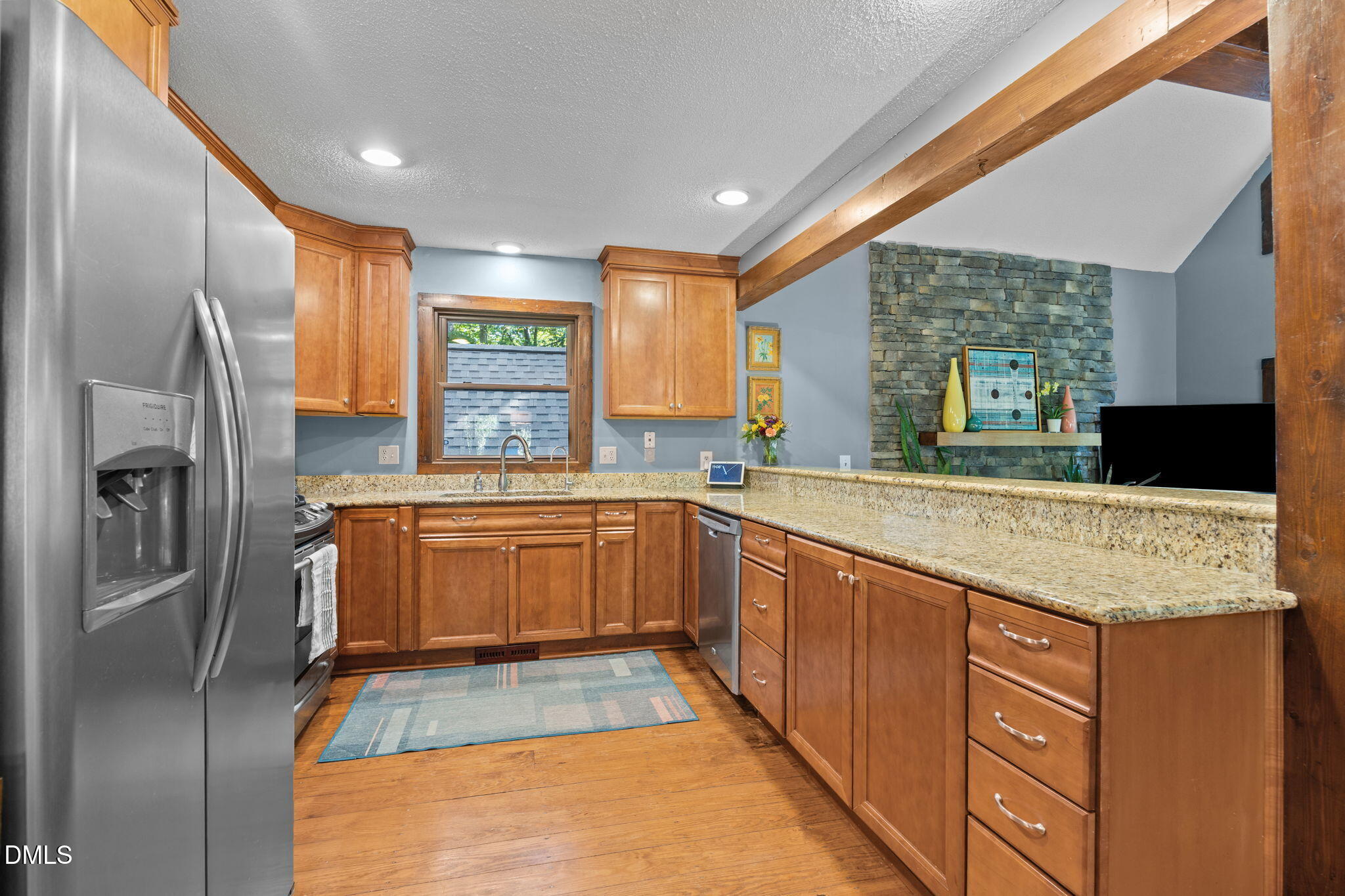 2408 Windsor Trail Raleigh, NC 27615 - Photo 9 of 45 a kitchen with stainless steel appliances granite countertop a refrigerator and a sink