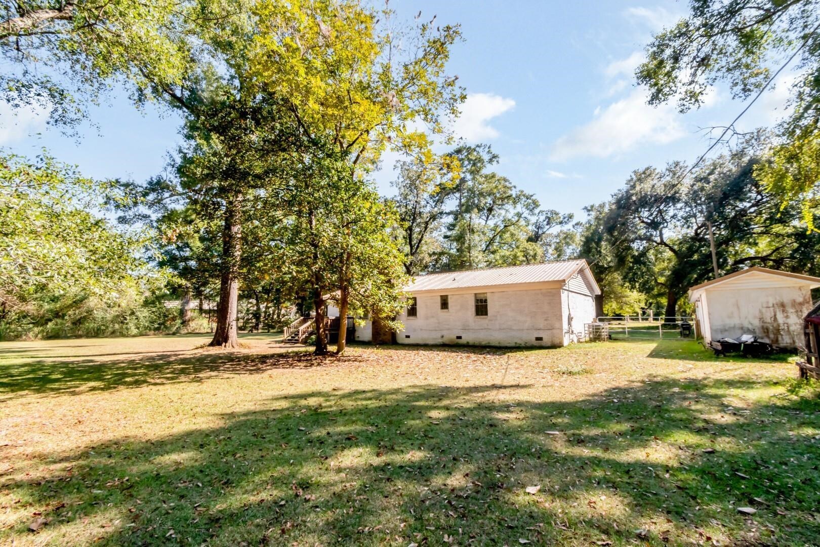 6405 1st Street Wilmer, AL 36587 - Photo 18 of 38 View of yard featuring view of scattered trees