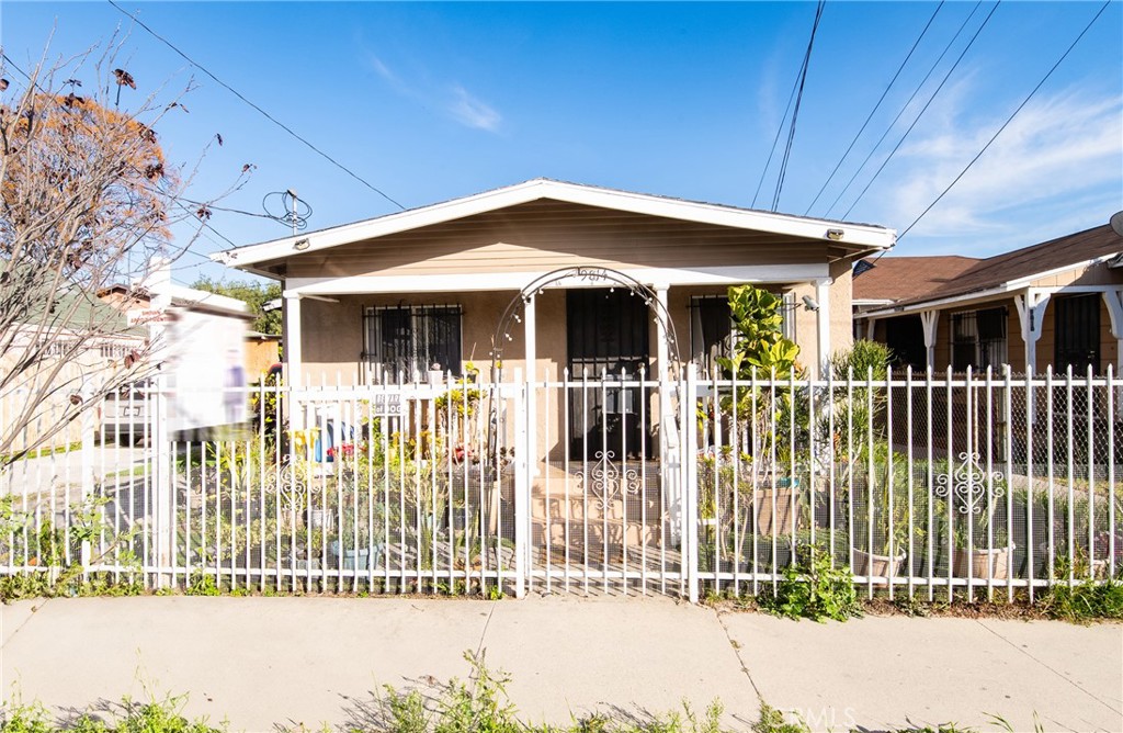 9814 Bandera Street Los Angeles, CA 90002 - Photo 2 of 15 a front view of a house