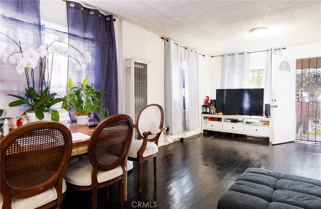 9814 Bandera Street Los Angeles, CA 90002 - Photo 9 of 15 a view of a livingroom with furniture and a potted plant