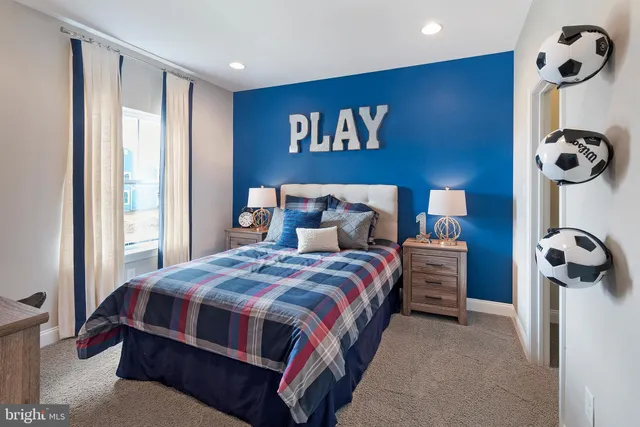 a bedroom with a bed and cabinets