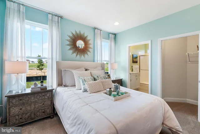 a bedroom with bed and window