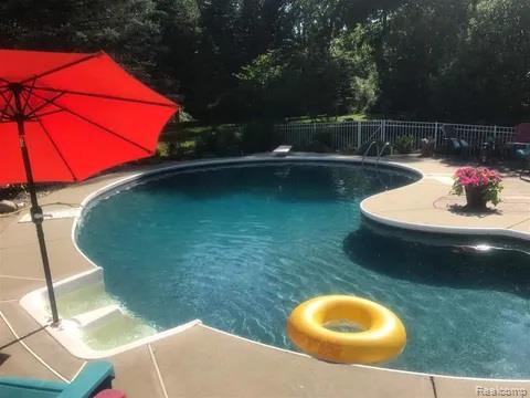 14017 North Belsay Road Millington, MI 48746 - Photo 33 of 43 View of pool with a patio
