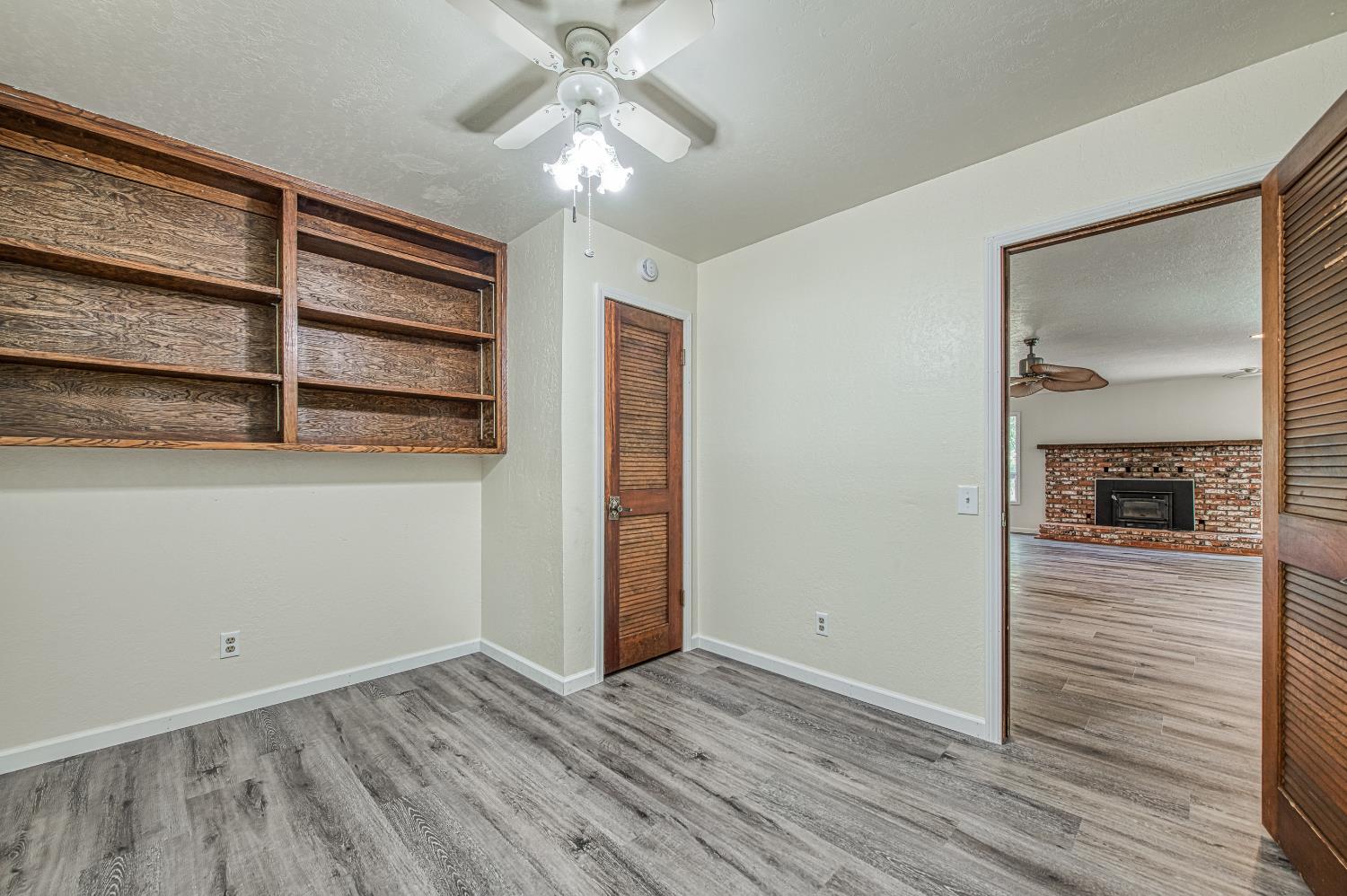 33988 Shaver Springs Road Auberry, CA 93602 - Photo 26 of 34 wooden floor in an empty room with a window