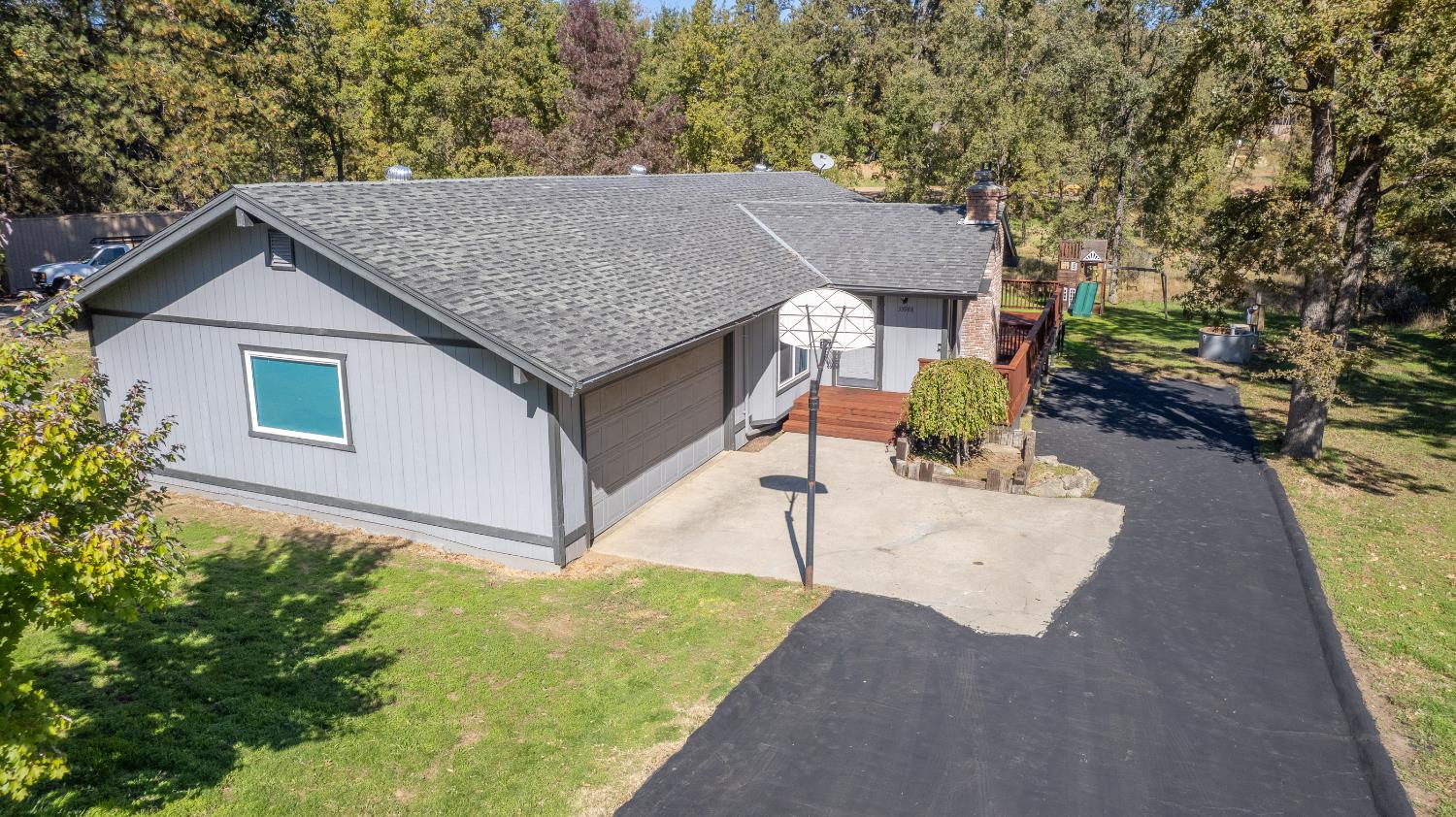 33988 Shaver Springs Road Auberry, CA 93602 - Photo 33 of 34 a aerial view of a house with table and chairs under an umbrella