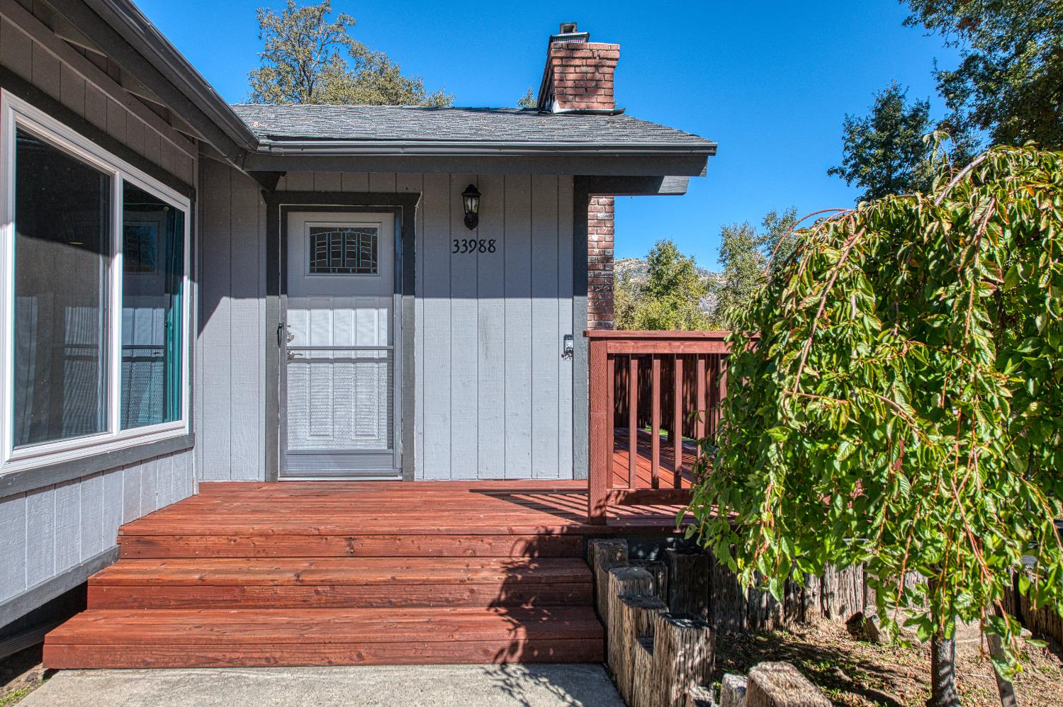 33988 Shaver Springs Road Auberry, CA 93602 - Photo 10 of 34 a front view of a house with a garden