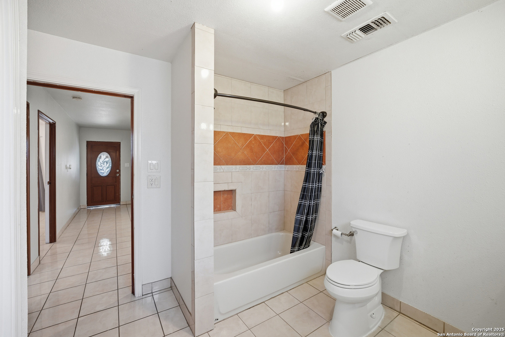 406 North Rancho Road Nixon, TX 78140 - Photo 18 of 31 a bathroom with a toilet and a shower