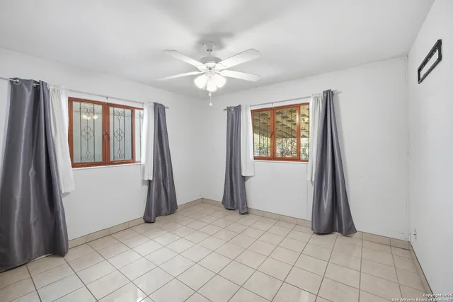 a bathroom with a toilet and shower