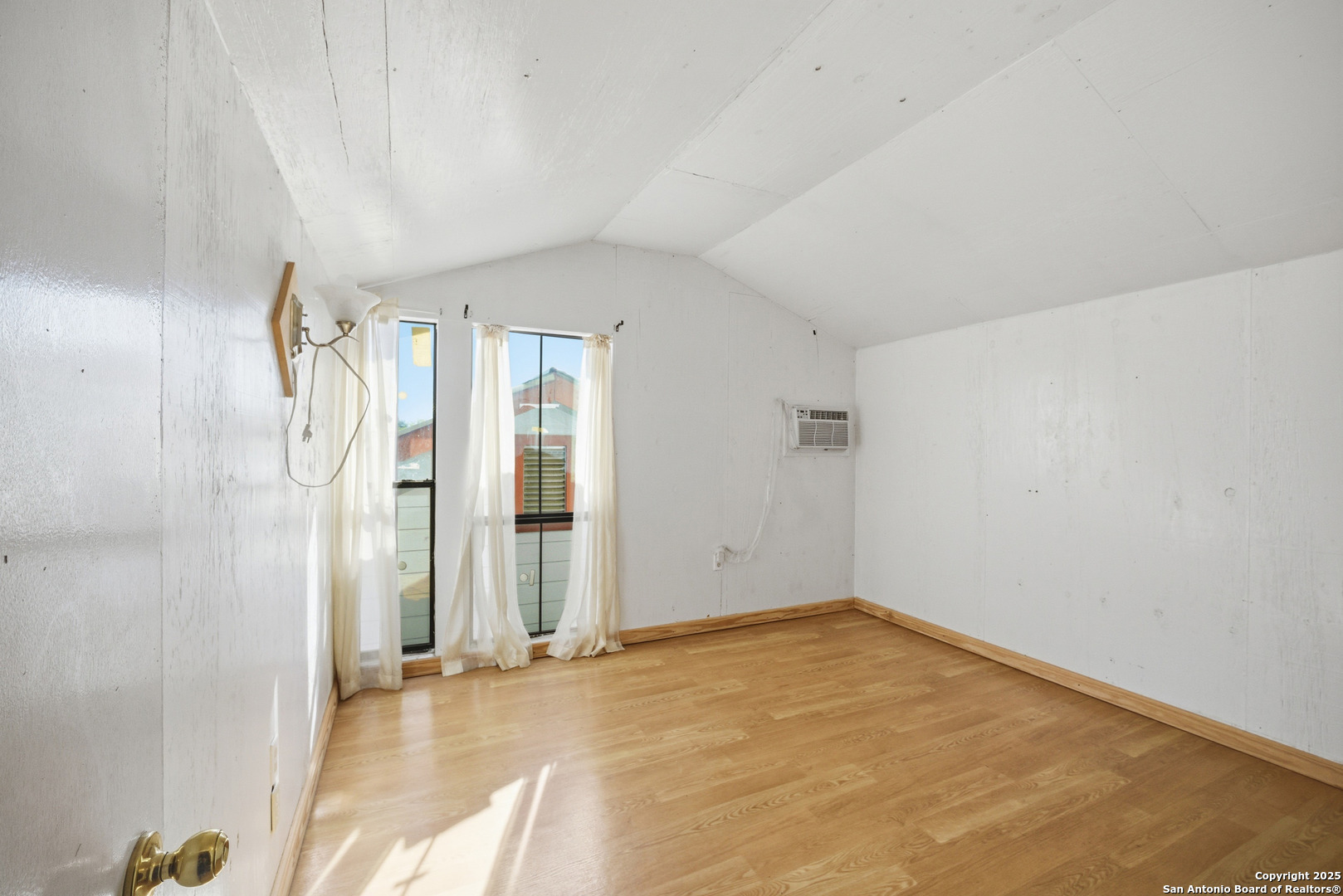 406 North Rancho Road Nixon, TX 78140 - Photo 26 of 31 an empty room with a empty space and windows