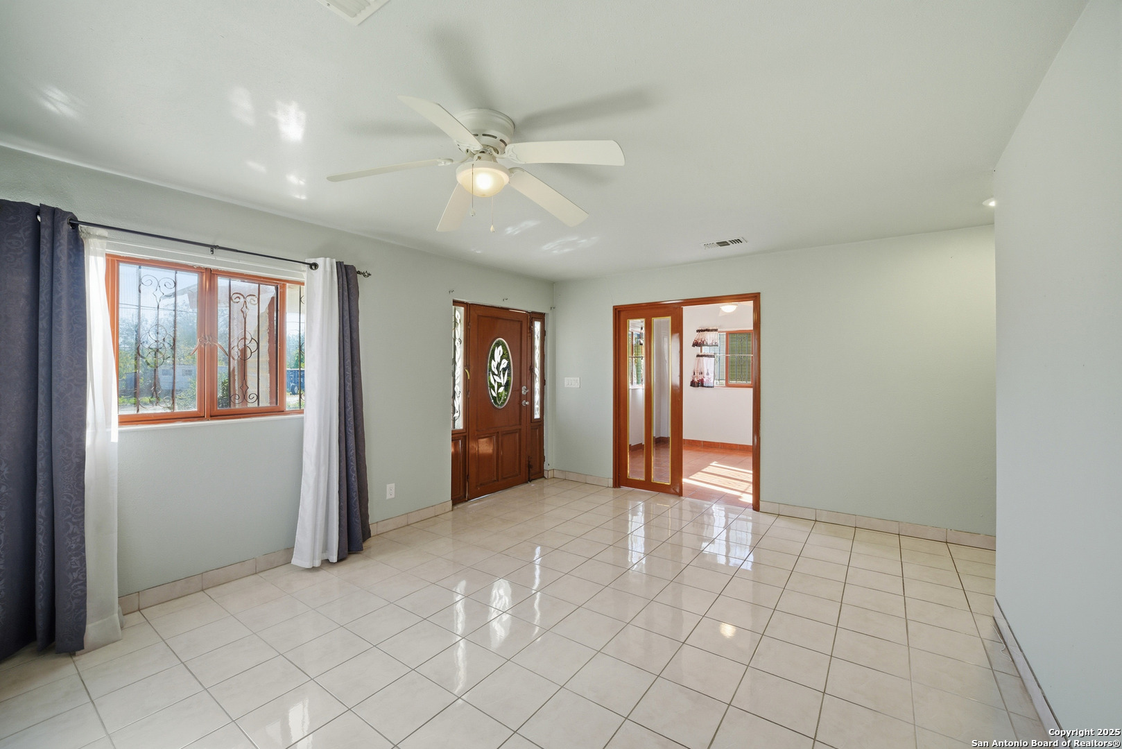 406 North Rancho Road Nixon, TX 78140 - Photo 7 of 31 a view of an empty room with window and chandelier fan