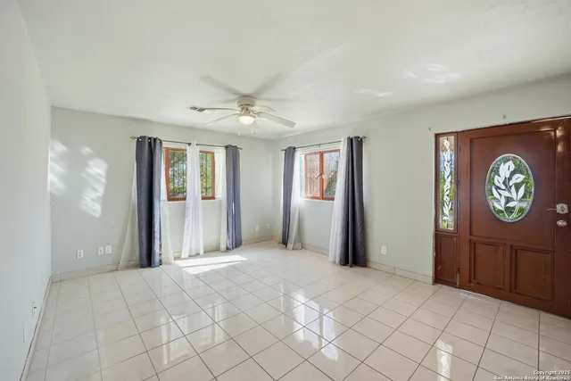 a view of an entryway with wooden floor