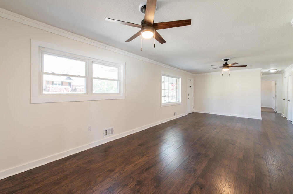 335 Indian Trail Augusta, GA 30907 - Photo 8 of 24 a view of empty room with wooden floor and fan