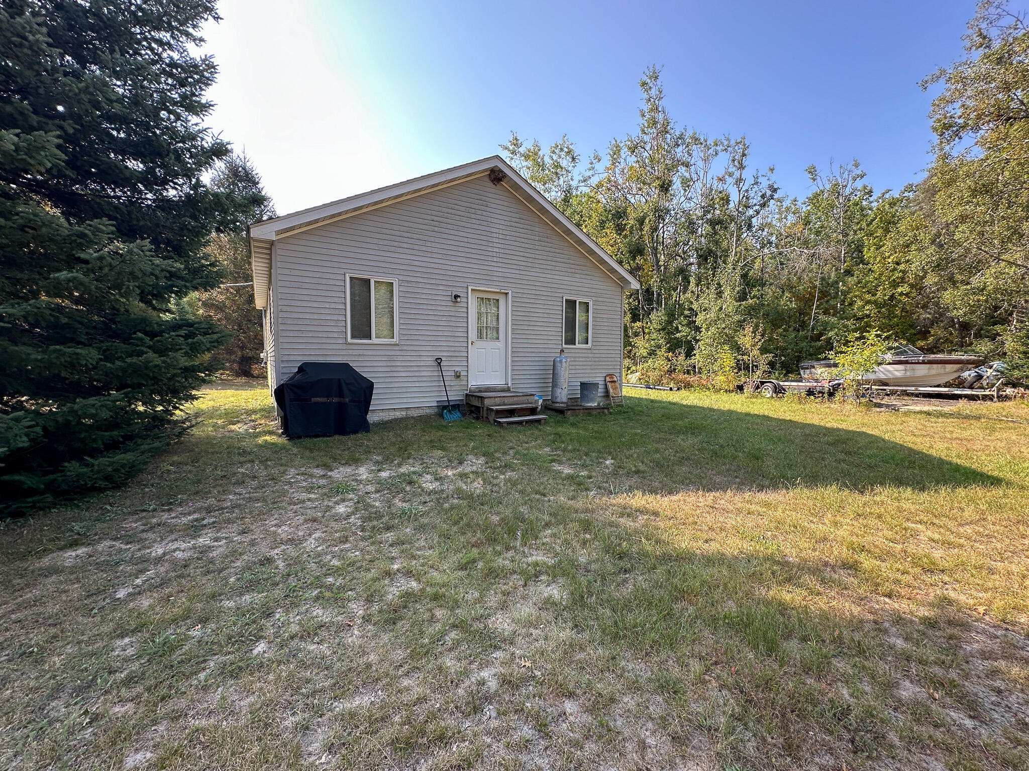 596 North River Road Marion, MI 49665 - Photo 5 of 49 C Front left